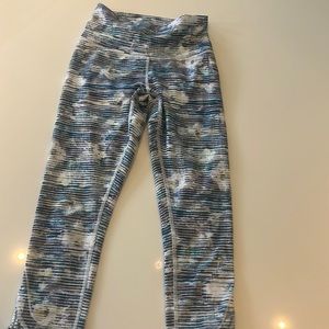 Lulu lemon tights with cut out detail in back of lower leg - calf length.